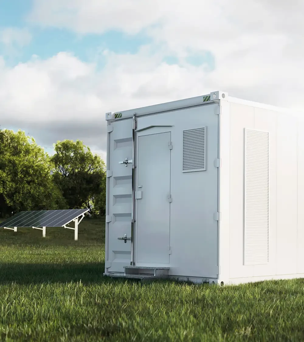 A large gray metal container on a green field with solar panels in the background