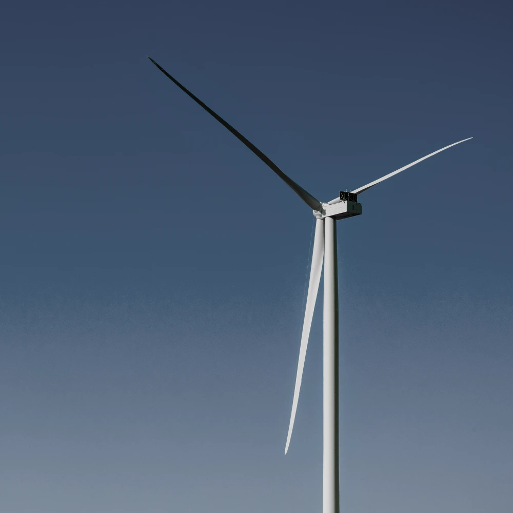 Wind turbine against a clear blue sky