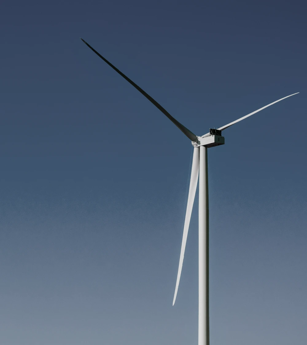 Wind turbine against a clear blue sky